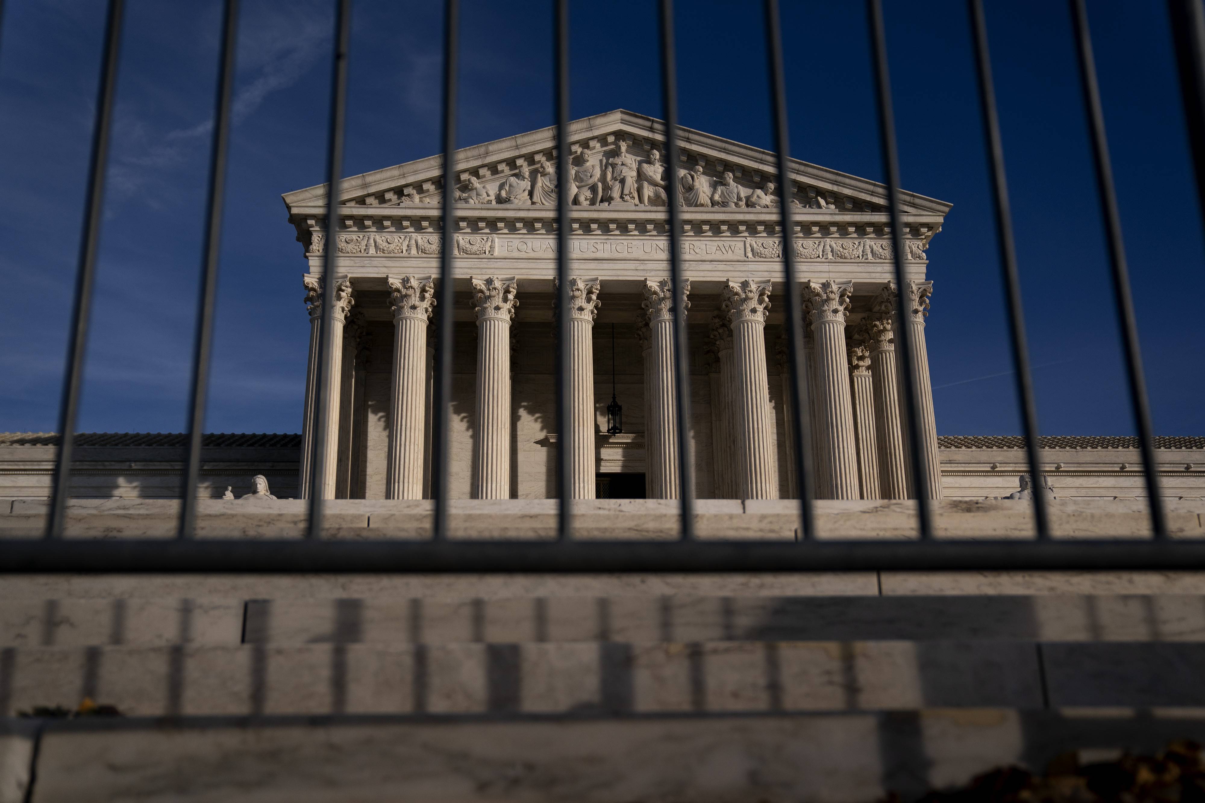 Supreme Court seen through barricades.