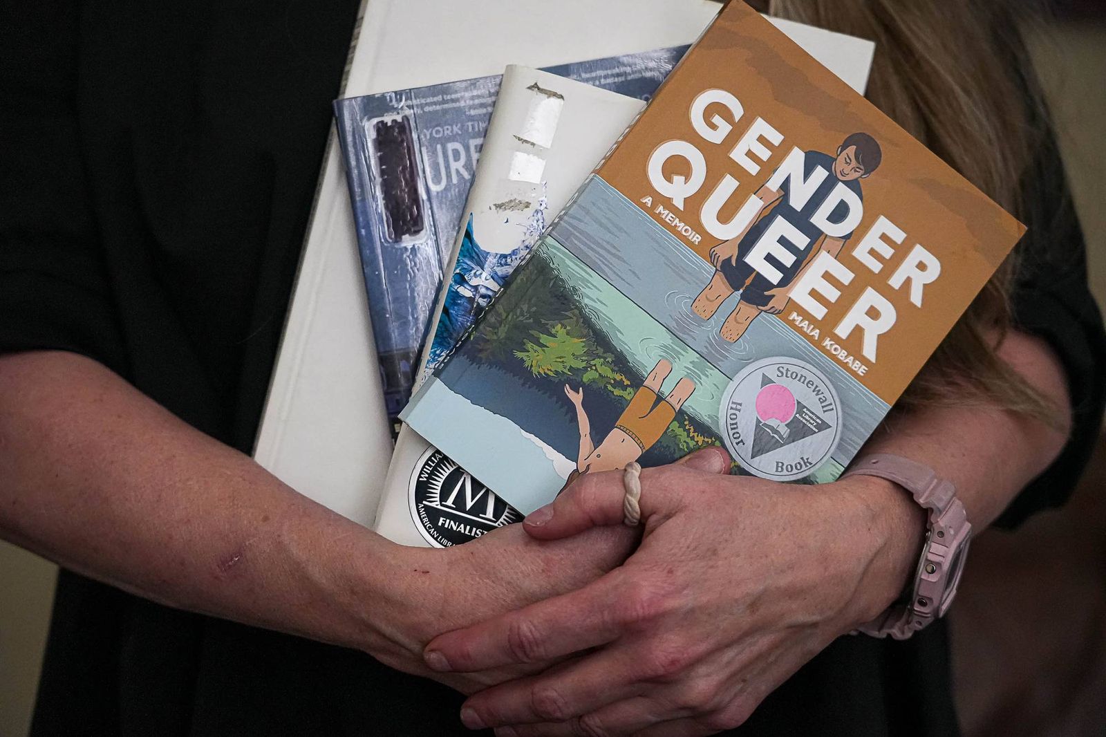 suzette-baker-former-head-librarian-at-the-kingsland-branch-library-in-the-llano-county-library-system-holds-some-banned-books.jpg?id=68054424&width=2000&height=1333&coordinates=0%2C0%2C0%2C0
