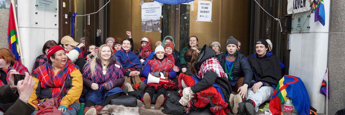 Sweden's Greta Thunberg (rear, 3rd from right) and other young climate activists block the entrance of Norway's Energy Ministry