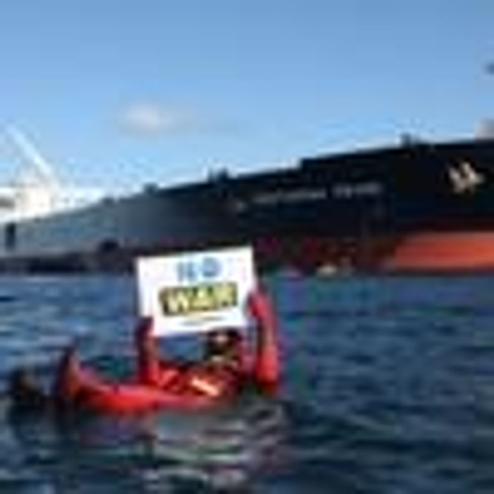 Swimmers and kayakers attempt to block a Russian tanker transporting oil in Danish waters on March 31, 2022.