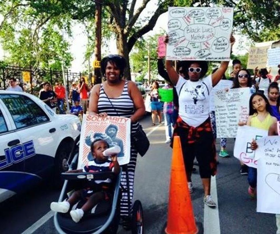 Takema (one of the Mothers with a Vision organizers) and Baby August at a Black spring gathering earlier this month. (Photo courtesy of Audrey Stewart)