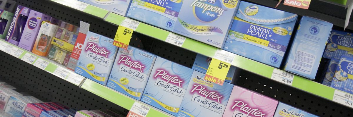 Tampons and other feminine hygiene products on a store shelf.