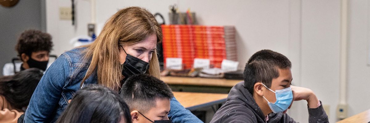 Teacher and students wearing masks