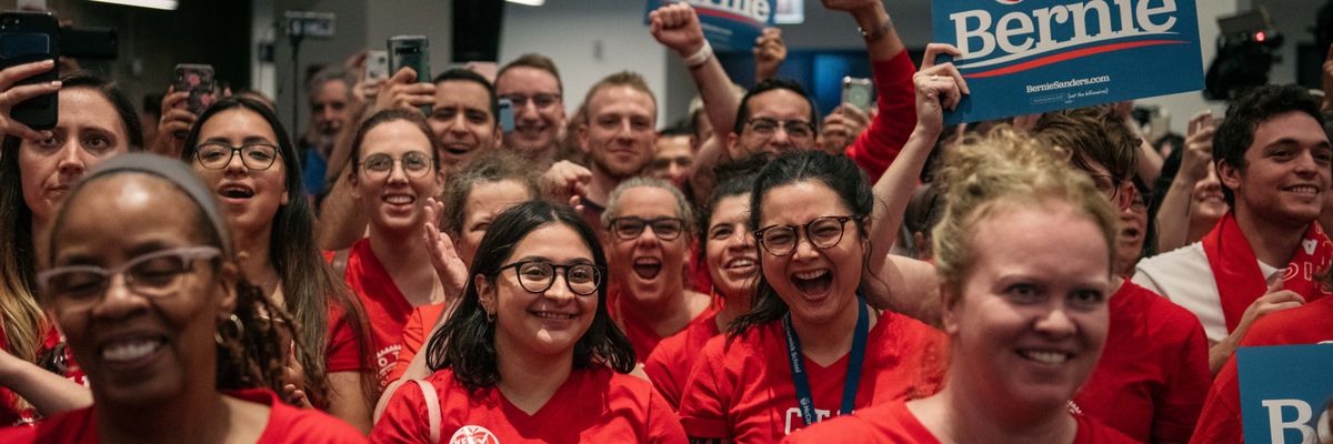 Teachers cheer for Democratic presidential candidate Sen. Bernie Sanders