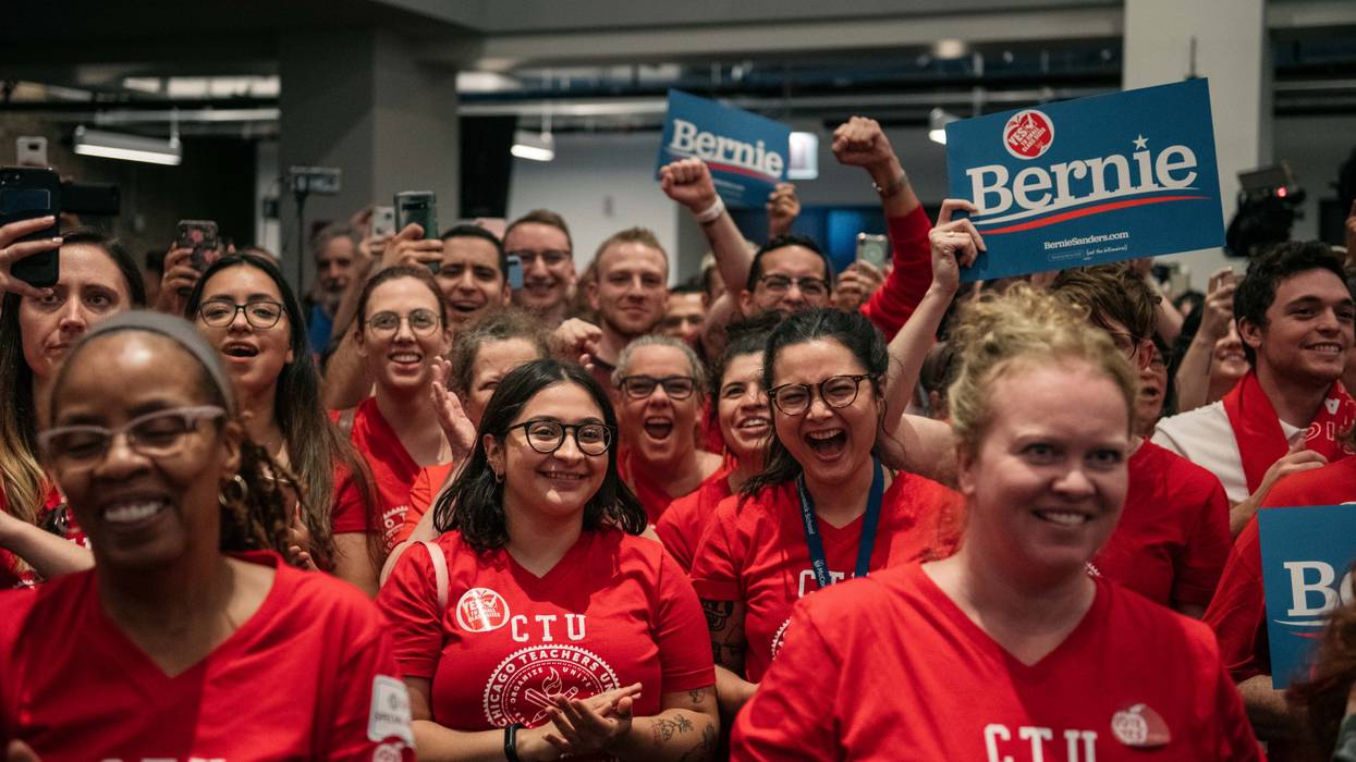 Teachers cheer for Democratic presidential candidate Sen. Bernie Sanders