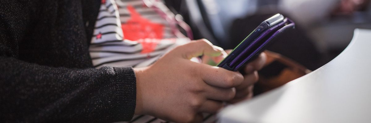 Teenage girl using smartphone