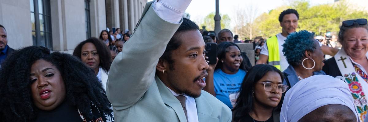 Tennessee Rep. Justin Jones (D-52) raises his fist after being reinstated to his seat on April 10, 2023 in Nashville.