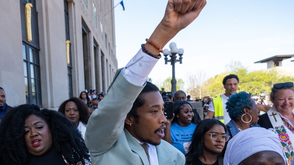 Tennessee Rep. Justin Jones (D-52) raises his fist after being reinstated to his seat on April 10, 2023 in Nashville.