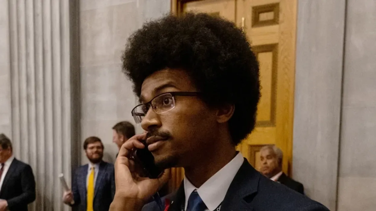 Tennessee Rep. Justin Pearson (D-86) speaks on his phone while being expelled from the state Legislature on April 6, 2023 in Nashville. 