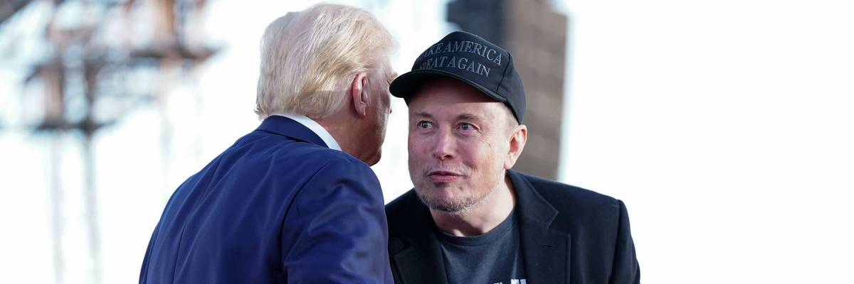 Tesla and SpaceX CEO Elon Musk speaks with former president Donald Trump