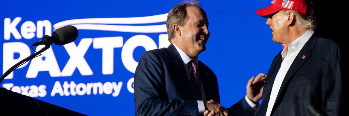 Texas Attorney General Ken Paxton greets former U.S. President Donald Trump