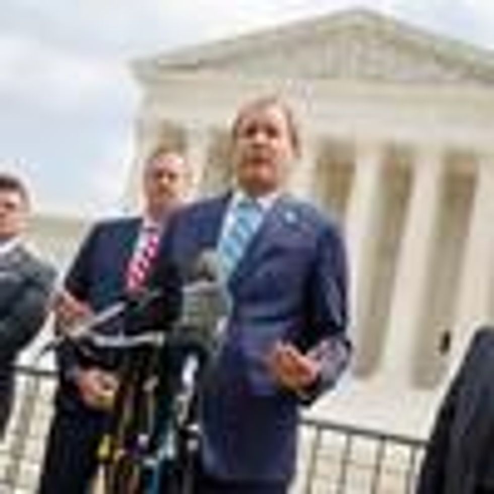 Texas Attorney General Ken Paxton speaks to reporters