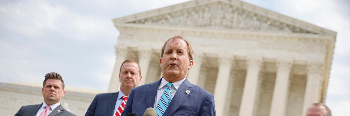Texas Attorney General Ken Paxton speaks to reporters