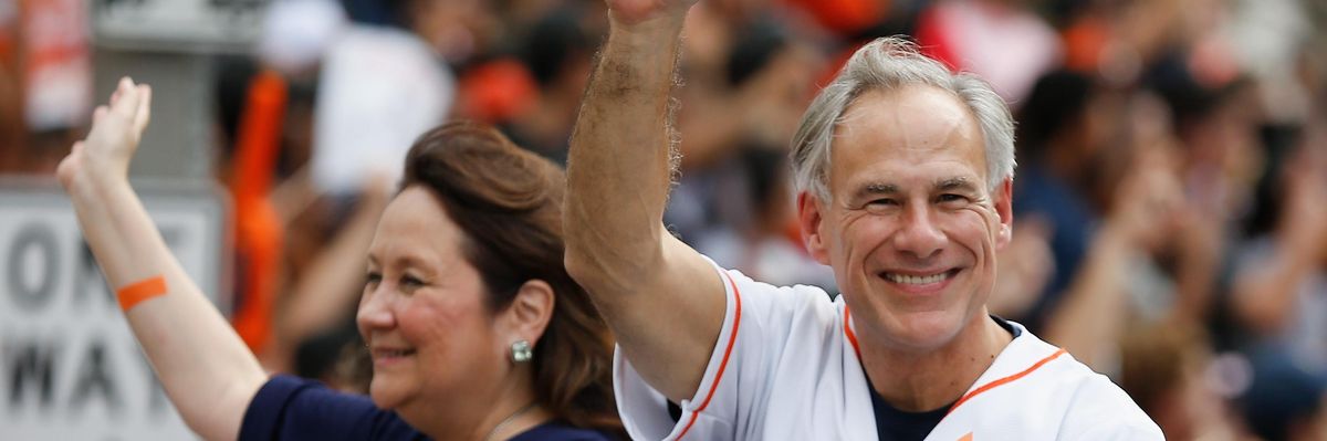 Texas Governor Greg Abbott and wife Cecilia Abbott wave