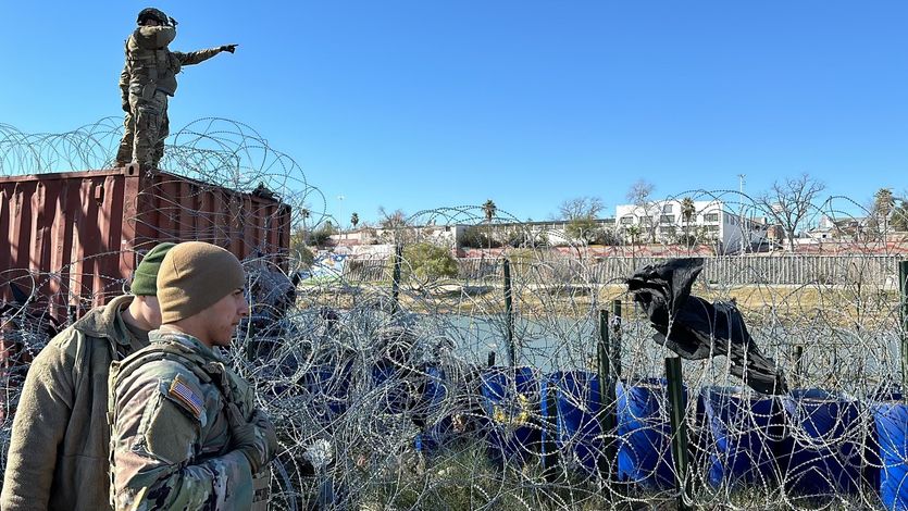 Texas National Guard at border with razor wire.