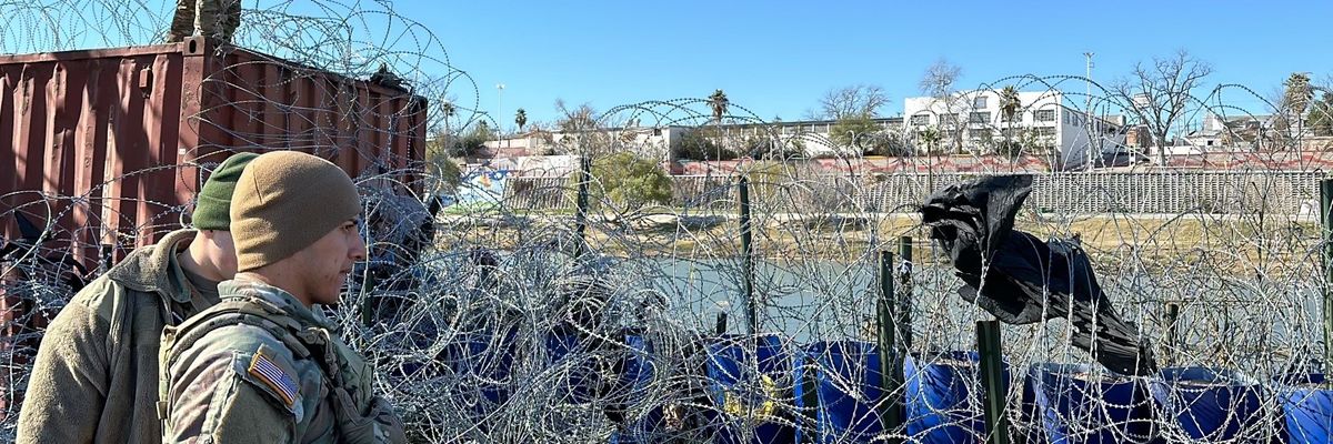 Texas National Guard at border with razor wire.