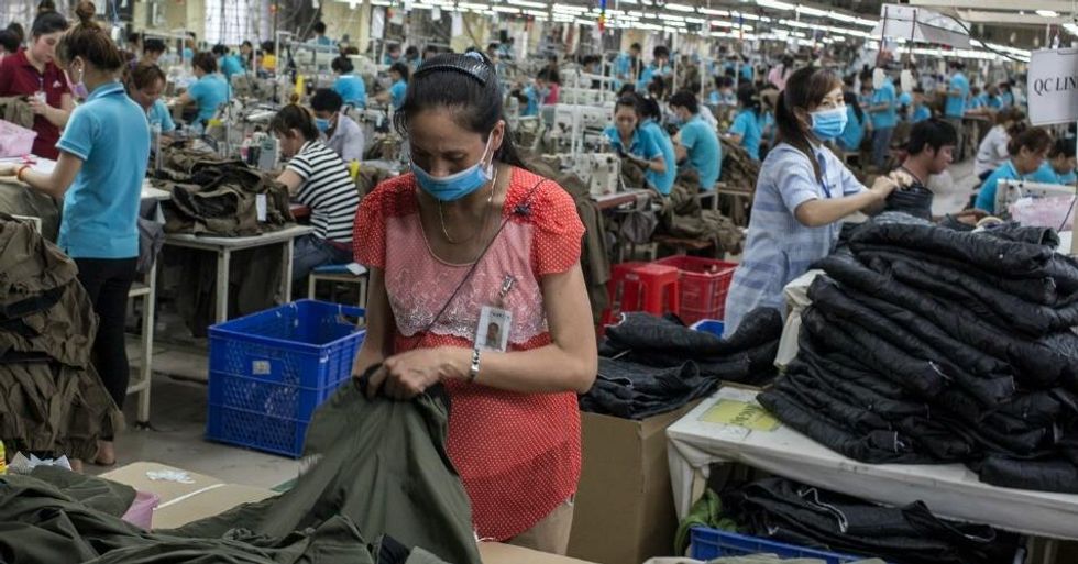 Tham, 23, cleans the small room in which she lives in an industrial district of Hai Duong, Vietnam. (Photo: Sam Tarling/Oxfam International)