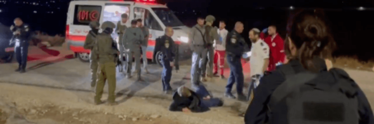 The activist Andrey X is seen on the ground after being attacked by Israeli settlers