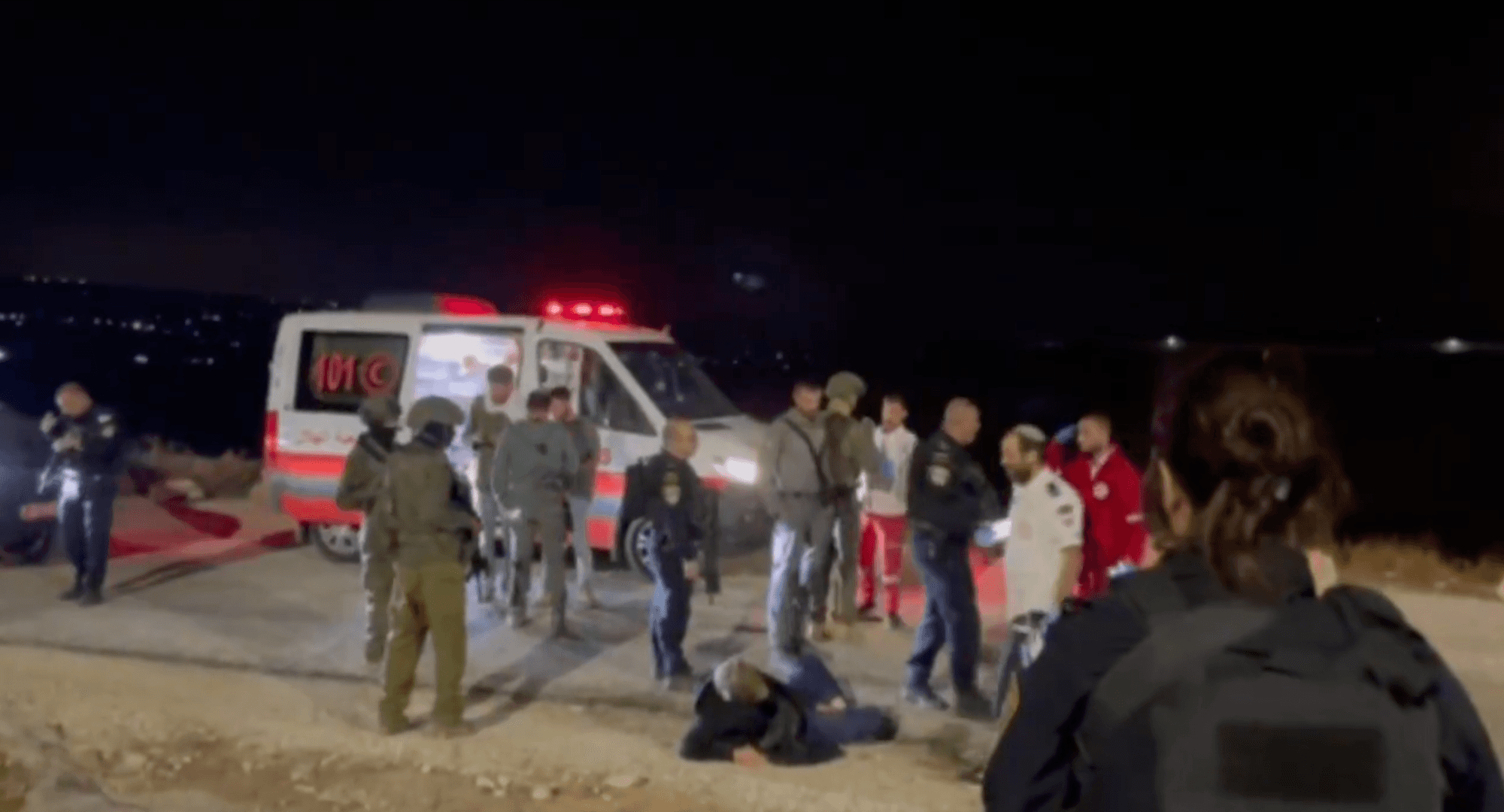 The activist Andrey X is seen on the ground after being attacked by Israeli settlers