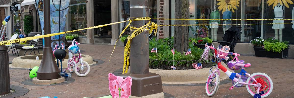 The aftermath of the Highland Park shooting is pictured