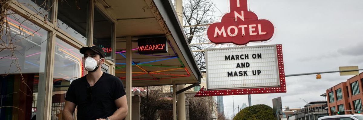 The Austin Motel displays a sign encouraging mask-wearing.