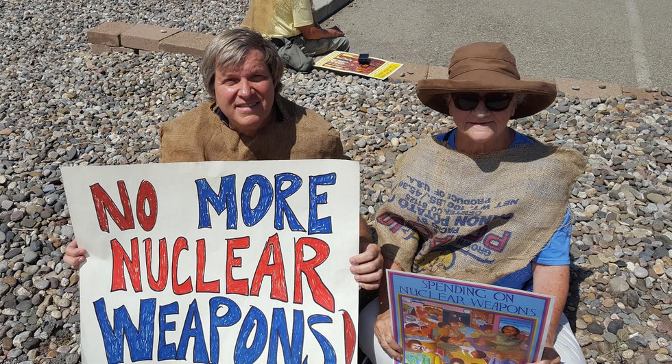 The author (l) sits with another activist during the nonviolent demonstration in Los Alamos, New Mexico over the weekend. (Photo: Courtesy of the author)