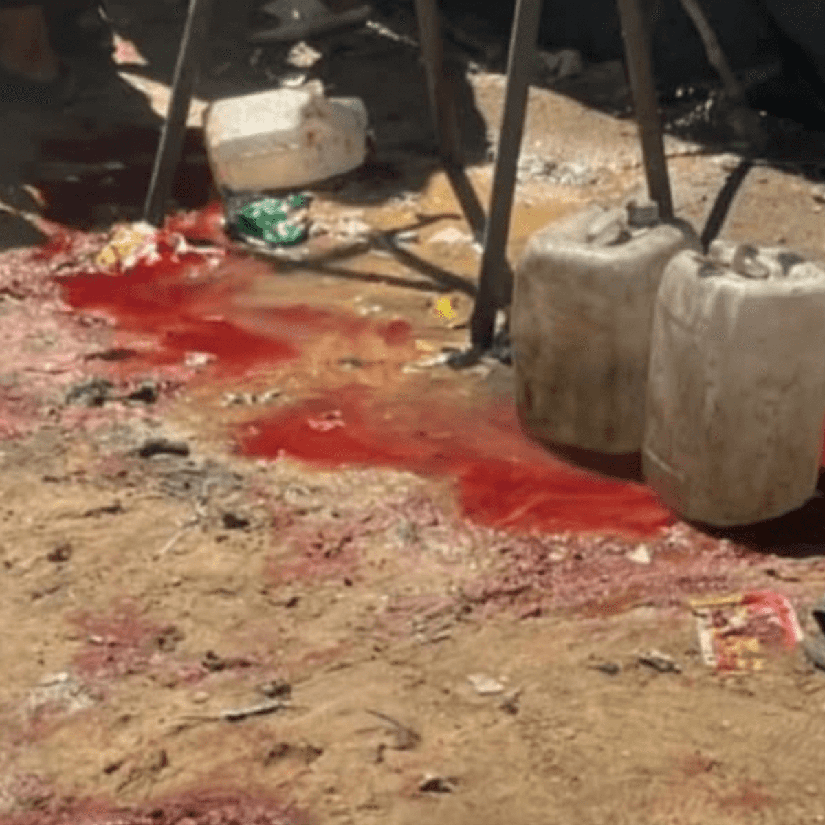 the bloody aftermath of an Israeli massacre of people collecting water