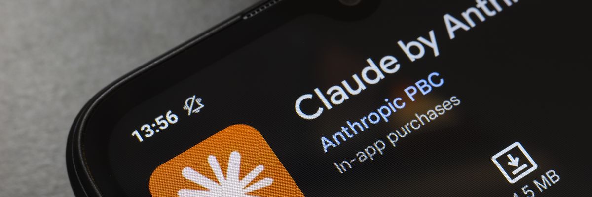 The Claude by Anthropic app logo appears on the screen of a smartphone.