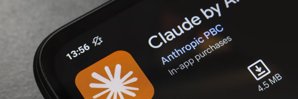 The Claude by Anthropic app logo appears on the screen of a smartphone.