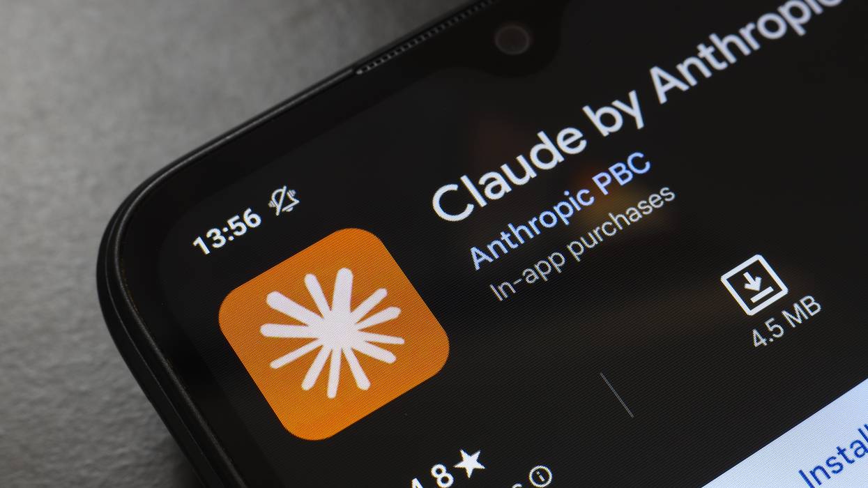 The Claude by Anthropic app logo appears on the screen of a smartphone.