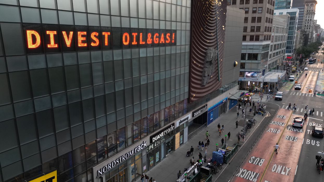 The Climate Clock in Union Square reads, "Divest oil & gas!"