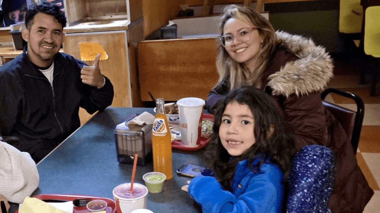 The Crespo-Gonzalez family—father Yohendry, mother Liseth, and 7-year-old Diana—pose for a photo