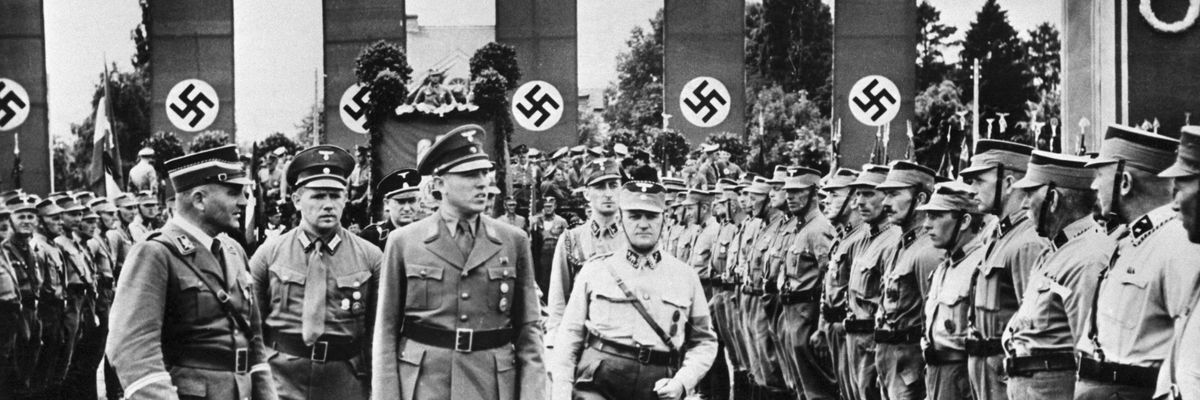 The Danzig district leader of the Nazi party, Albert Foerster reviews local Nazis standing in formation and wearing uniforms shortly before Hitler invaded Poland in 1939.​