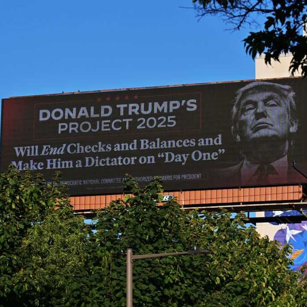 The Democratic National Committee Covers Philadelphia With Information On Trump Project 2025 With Billboards, Lite Brites, And A Plane Banner Flying Over Phillies Game