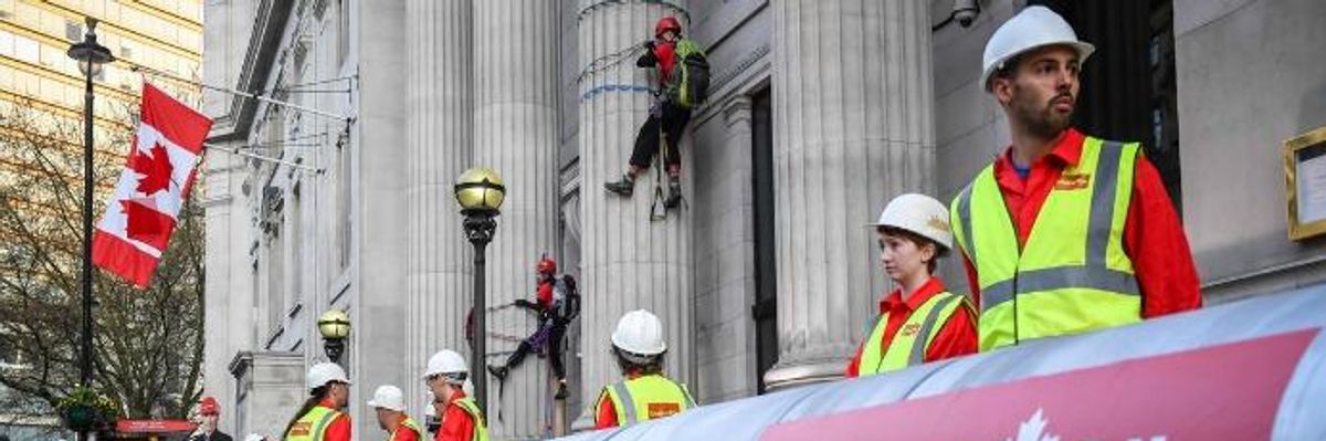 Because 'Climate Leaders Don't Build Pipelines,' Greenpeace Greets Trudeau in London With 'Crudeau Oil' Protest