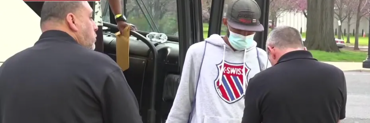 The first bus of migrants that Republican Texas Gov. Greg Abbott sent from the U.S.-Mexico border to Washington, D.C. arrived outside an office building that houses Fox News on April 13, 2022.