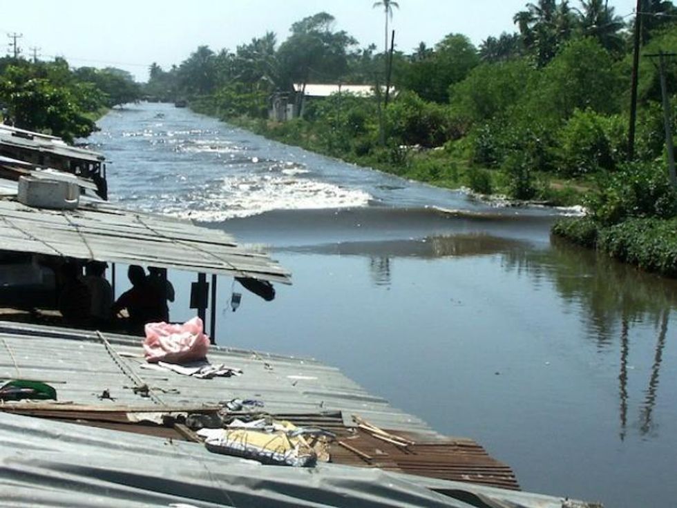 The first waves reached the interior of Sri Lanka along the Hamilton Canal located just south of the capital, Colombo, in the early hours of the morning. (Photo: Amantha Perera/IPS)