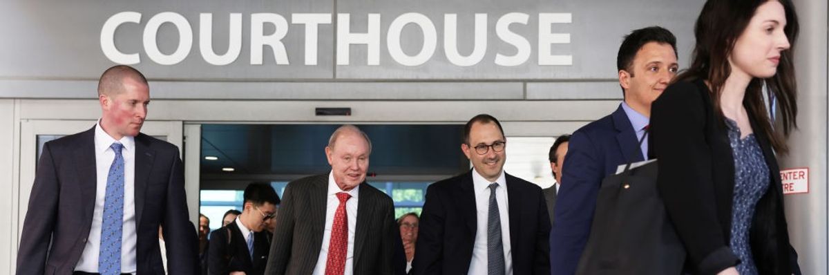 The Fox News legal team leaves the courthouse.