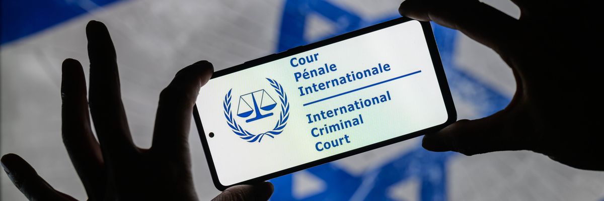 The International Court of Justice (ICJ) seal is displayed on a smartphone