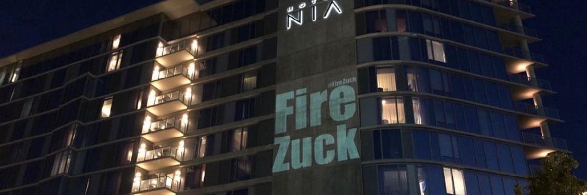 'Fire Zuck' Projected onto Hotel as Facebook Shareholders Arrive for Annual Meeting