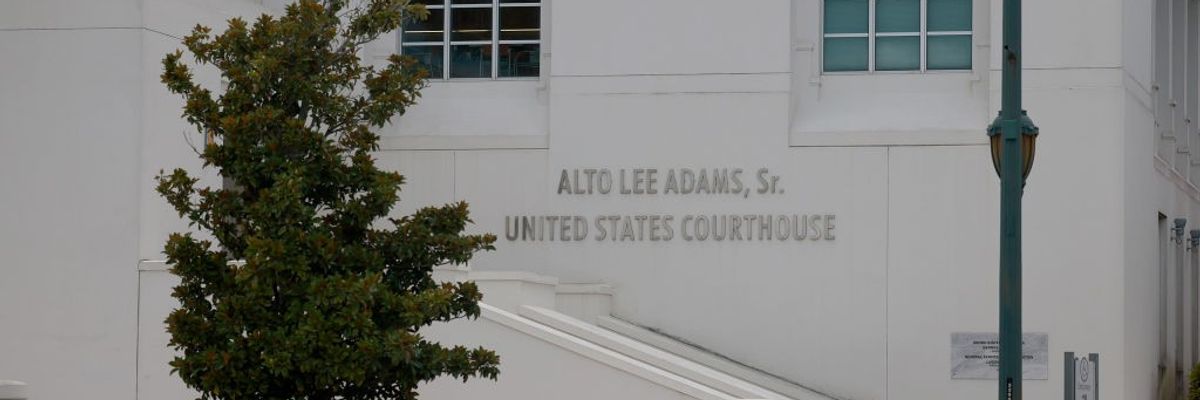 The label on the wall of the Alto Lee Adams Sr. United States Courthouse.
