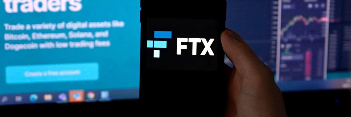 The logo of FTX, a cryptocurrency exchange platform, is shown on a smartphone screen in Arlington, Virginia on February 10, 2022.