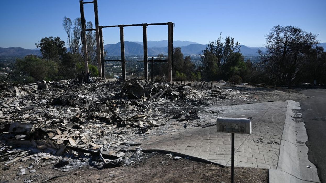 The mailbox and metal frame of a home destroyed by the Mountain Fire