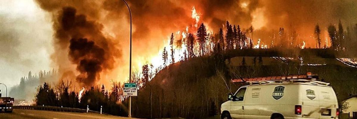 'All You See is Red Flames': State of Emergency as Wildfire Rages in Alberta