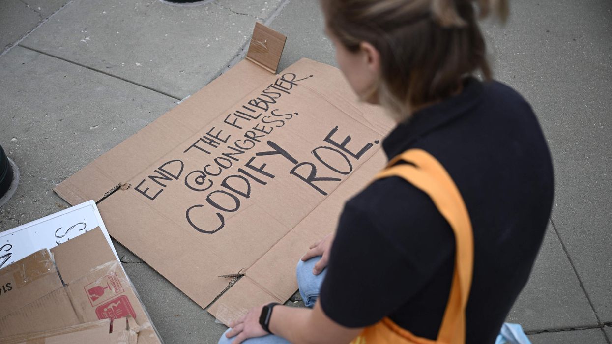 The sign reads "End the filibuster, Congress... Codify Roe"
