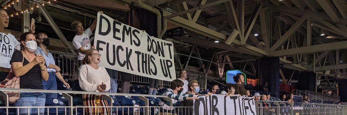 The sign says: "Dems Don't Fuck This Up"