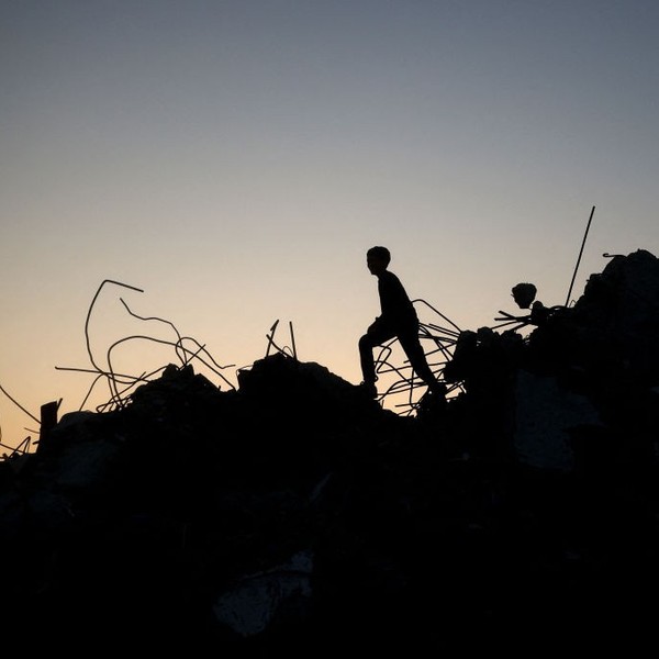 The silhouette of a Gazan child playing amid the rubble