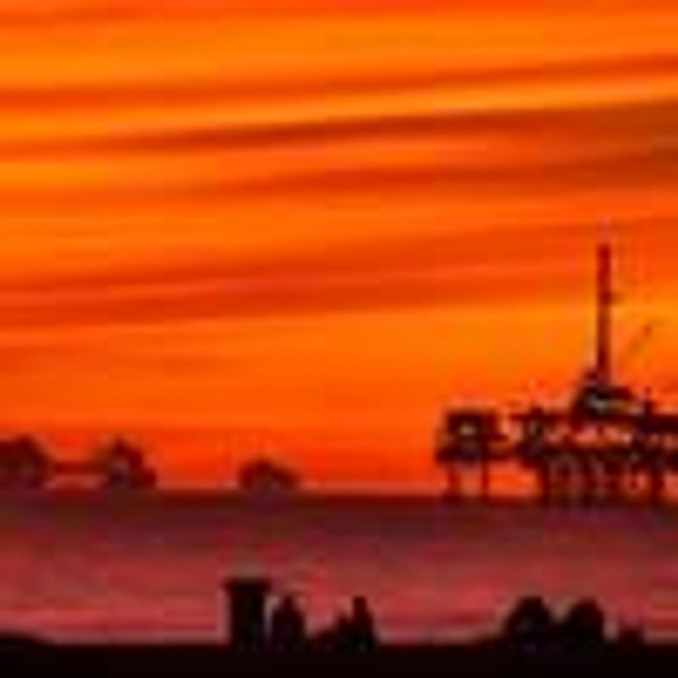 The sun sets over container ships and oil platforms off the coast of Huntington Beach, California on January 12, 2021. (Photo: Leonard Ortiz/MediaNews Group/Orange County Register via Getty Images)