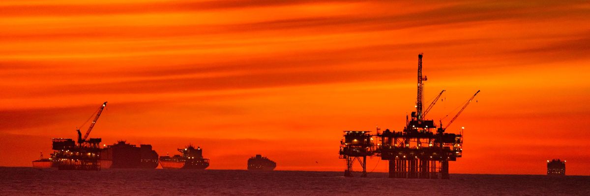 The sun sets over container ships and oil platforms off the coast of Huntington Beach, California on January 12, 2021. (Photo: Leonard Ortiz/MediaNews Group/Orange County Register via Getty Images)