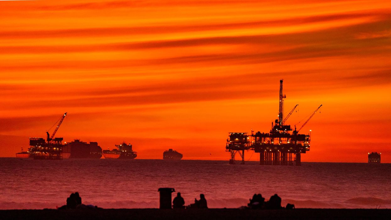 The sun sets over container ships and oil platforms off the coast of Huntington Beach, California on January 12, 2021. (Photo: Leonard Ortiz/MediaNews Group/Orange County Register via Getty Images)